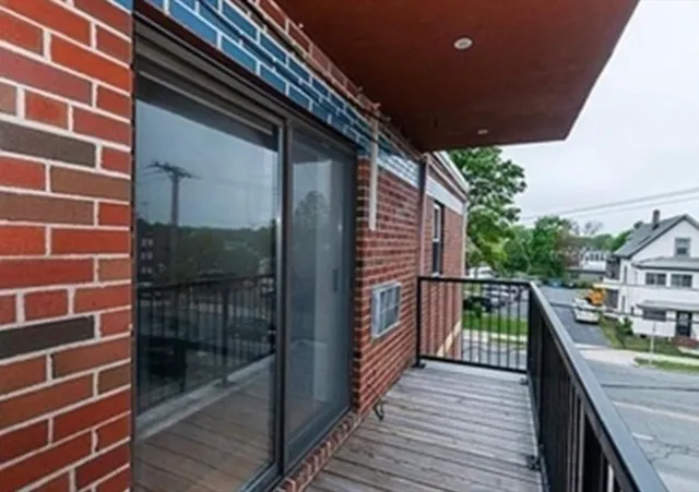 a balcony with wooden floor
