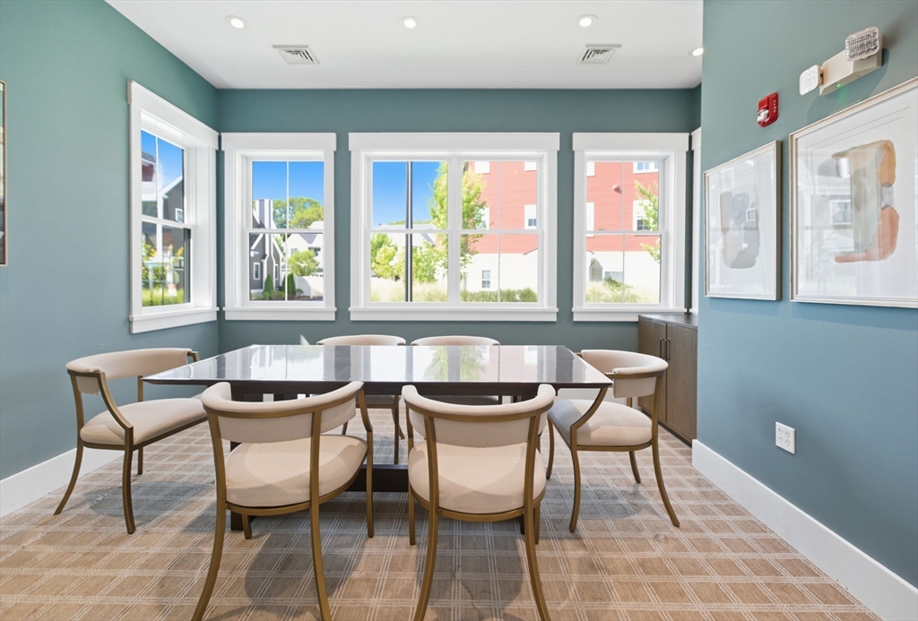 60 Coppersmith Way, Unit 208 Canton, MA 02021 - Photo 19 of 23 a dining room with furniture and window
