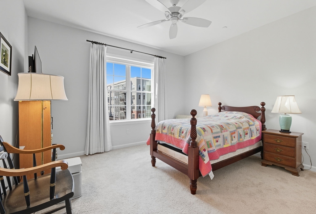 60 Coppersmith Way, Unit 208 Canton, MA 02021 - Photo 9 of 23 a bedroom with a bed and window