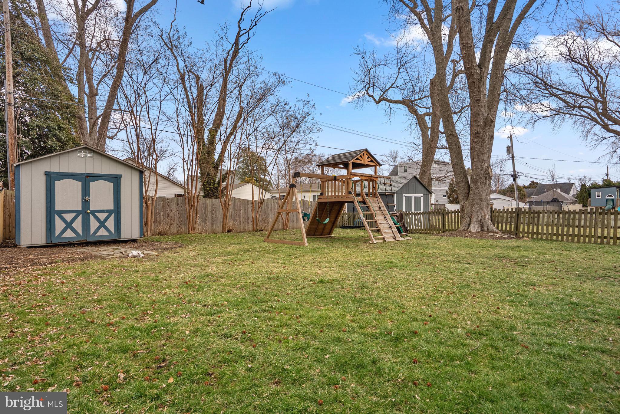 112 Elliott Place Edgewater, MD 21037 - Photo 37 of 56 Spacious flat fenced yard w/ storage and playset!
