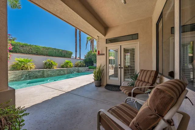 a view of house with a swimming pool