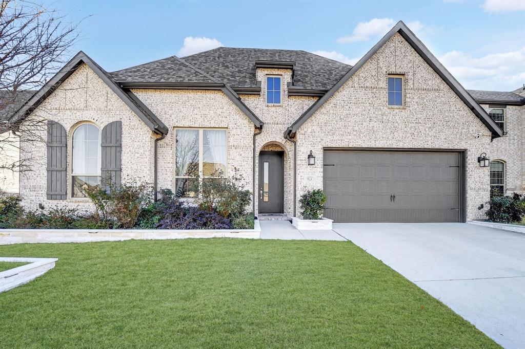 9624 Boulder Pt Road Oak Point, TX 75068 - Photo 1 of 1 a front view of a house with a yard and garage
