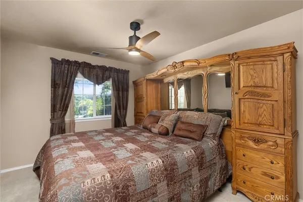 a front view of a house with a garden and a yard