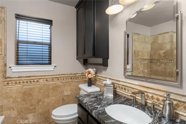 a view of a porch with furniture and garden