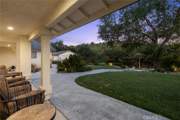 a view of a swimming pool with a patio