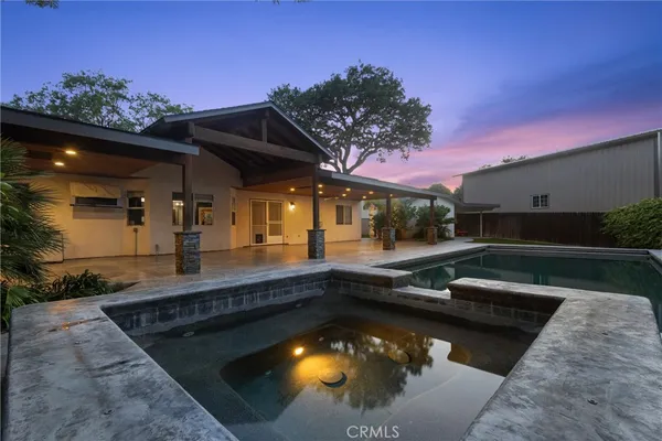 a view of a city with lush green forest