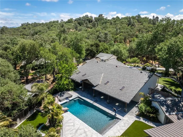 a view of a patio with a table and chairs