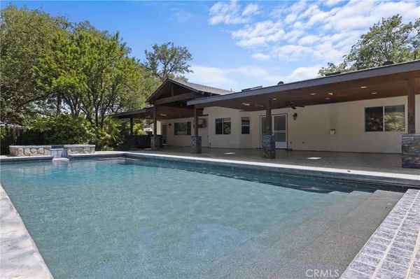a kitchen with cabinets a sink and appliances