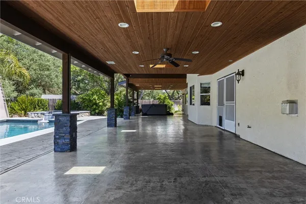 a kitchen with stainless steel appliances granite countertop a sink and a refrigerator