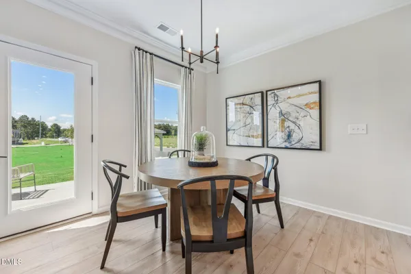 a view of a dining room with furniture window and outside view