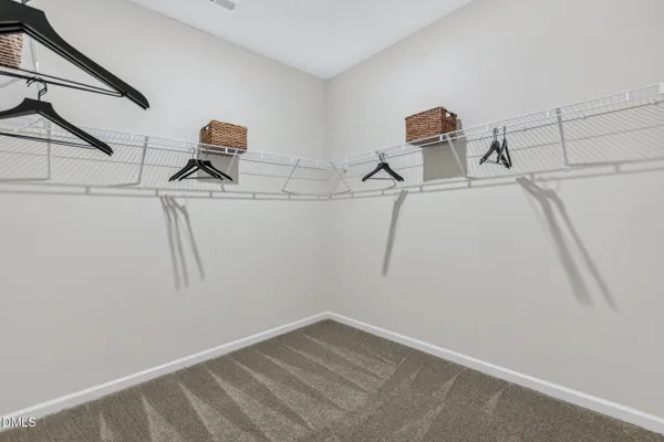 a view of storage and utility room with two washing machine