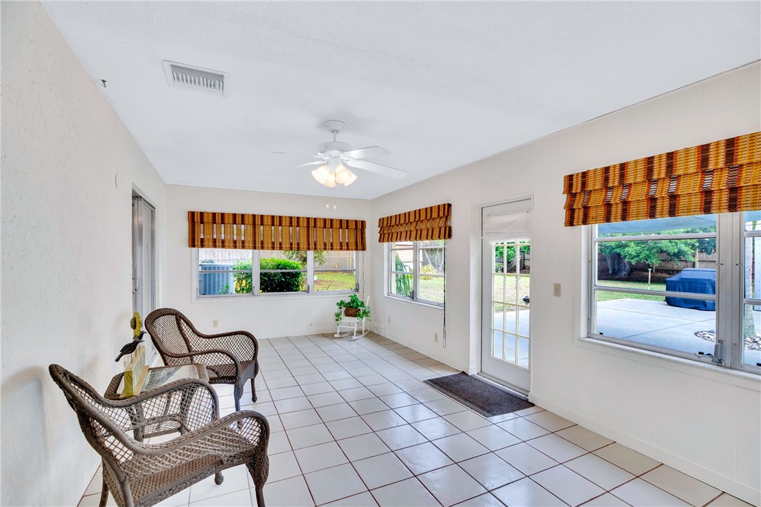 7666 134th Street Sebastian, FL 32958 - Photo 6 of 35 a view of a livingroom with furniture and floor to ceiling window