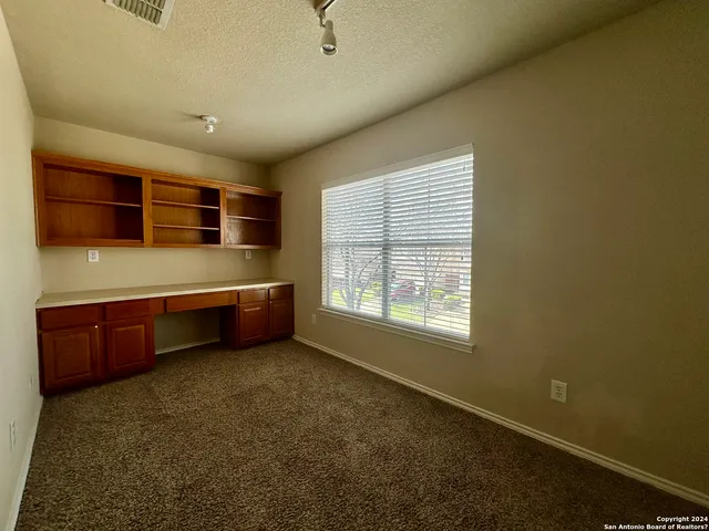 a room with a bed and a window