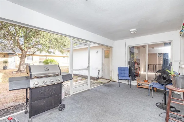 a view of workspace with furniture and windows