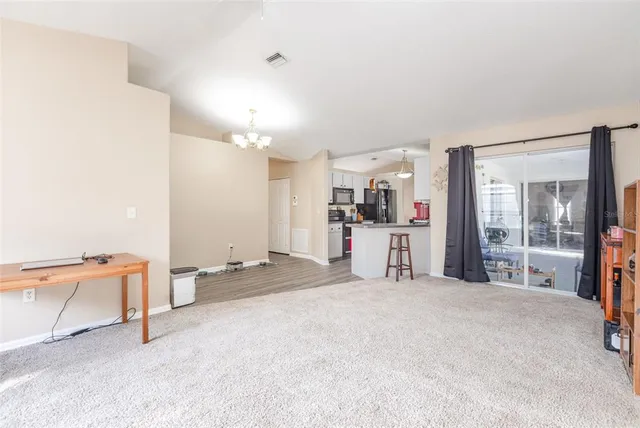 a large white bed in a white room