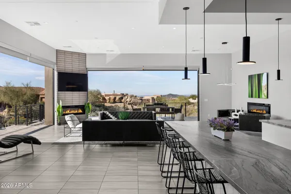 a kitchen with stainless steel appliances granite countertop a sink a stove and a refrigerator