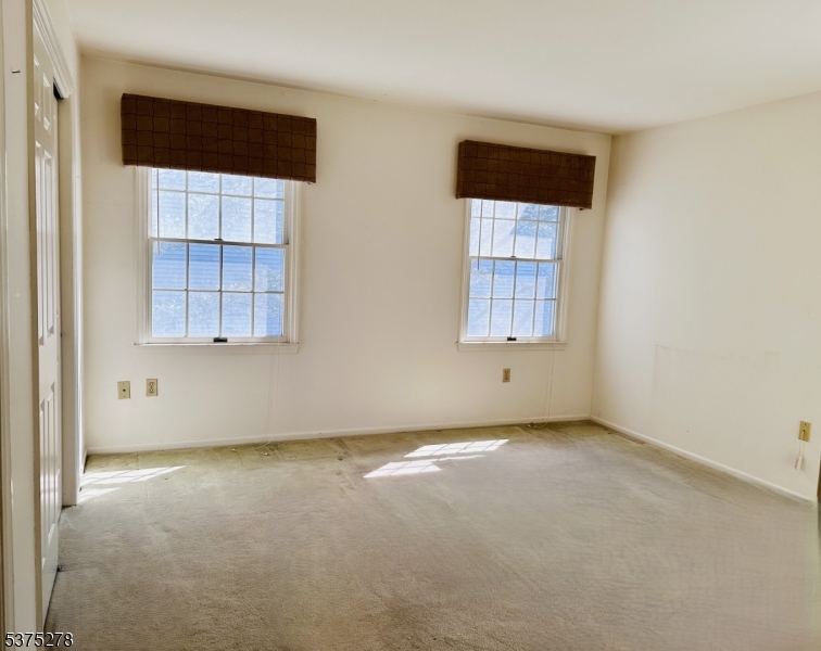 70 Boulder Run Road Paterson, NJ 07501 - Photo 4 of 29 an empty room with a window and doors