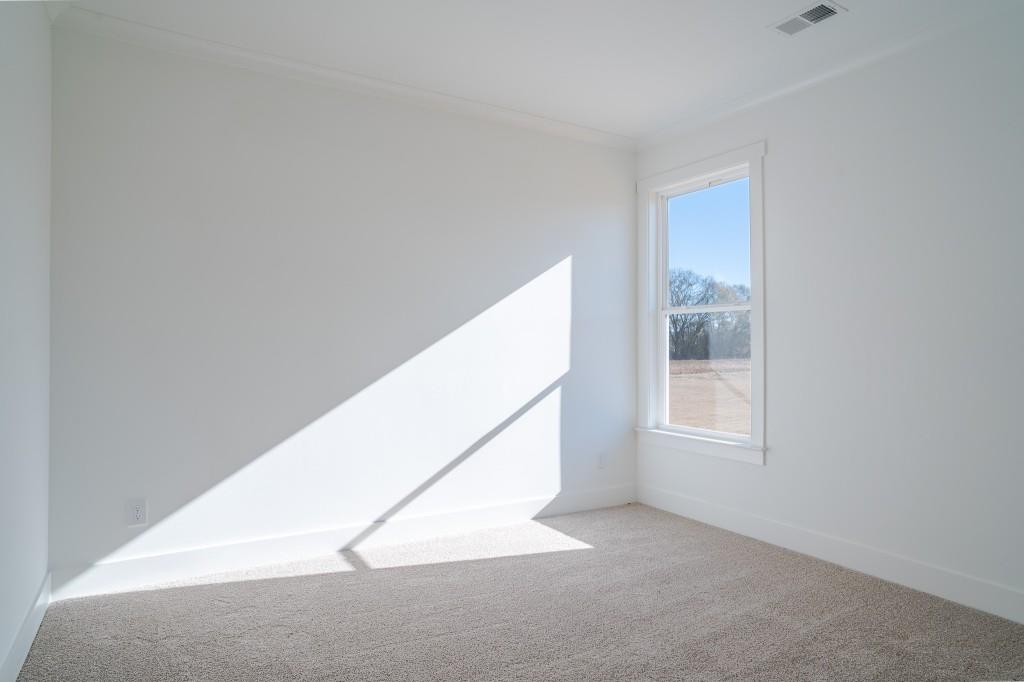 93 Tomahawk Trail Good Hope, GA 30641 - Photo 13 of 61 a view of an empty room and window