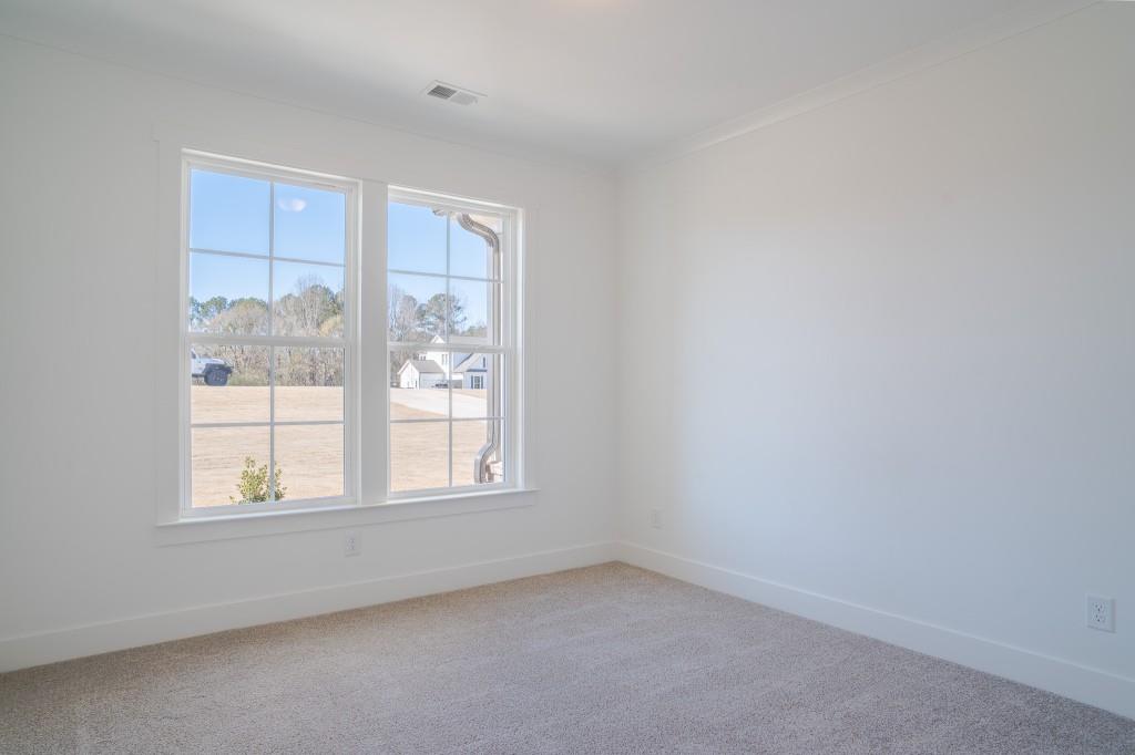 93 Tomahawk Trail Good Hope, GA 30641 - Photo 15 of 61 an empty room with a window