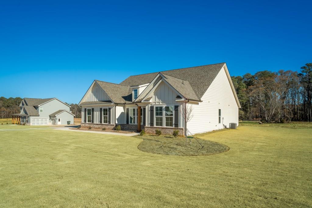 93 Tomahawk Trail Good Hope, GA 30641 - Photo 2 of 61 a view of a house with a big yard