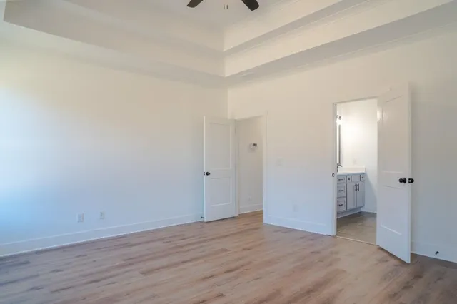 a bathroom with a double vanity sink and mirror