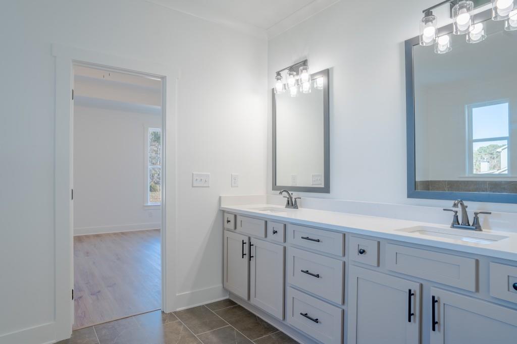 93 Tomahawk Trail Good Hope, GA 30641 - Photo 30 of 61 a bathroom with double vanity a and a mirror