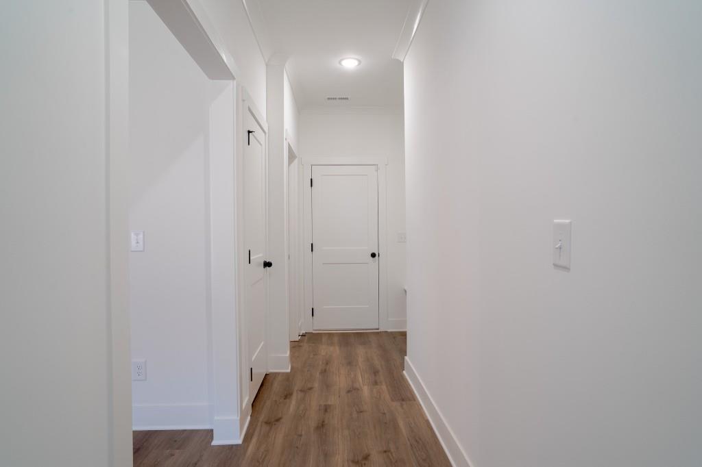 93 Tomahawk Trail Good Hope, GA 30641 - Photo 33 of 61 a view of a hallway with wooden floor