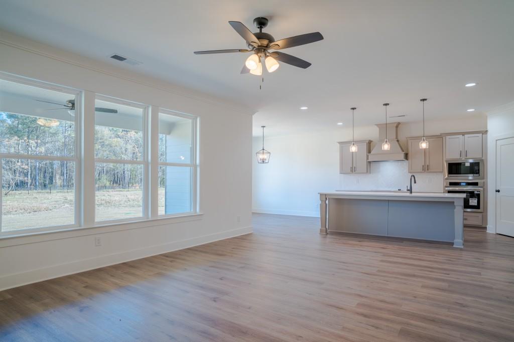 93 Tomahawk Trail Good Hope, GA 30641 - Photo 36 of 61 a view of kitchen with sink and wooden floor