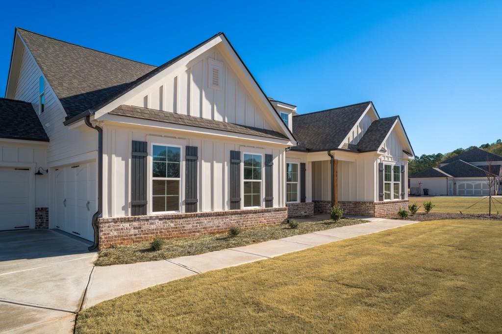 93 Tomahawk Trail Good Hope, GA 30641 - Photo 7 of 61 a front view of a house with a yard