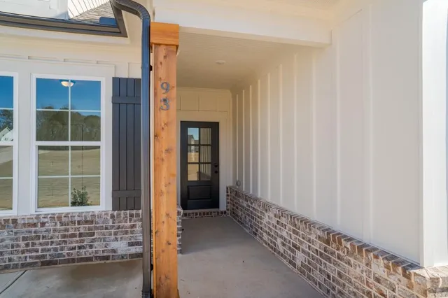 a view of hallway with wooden floor