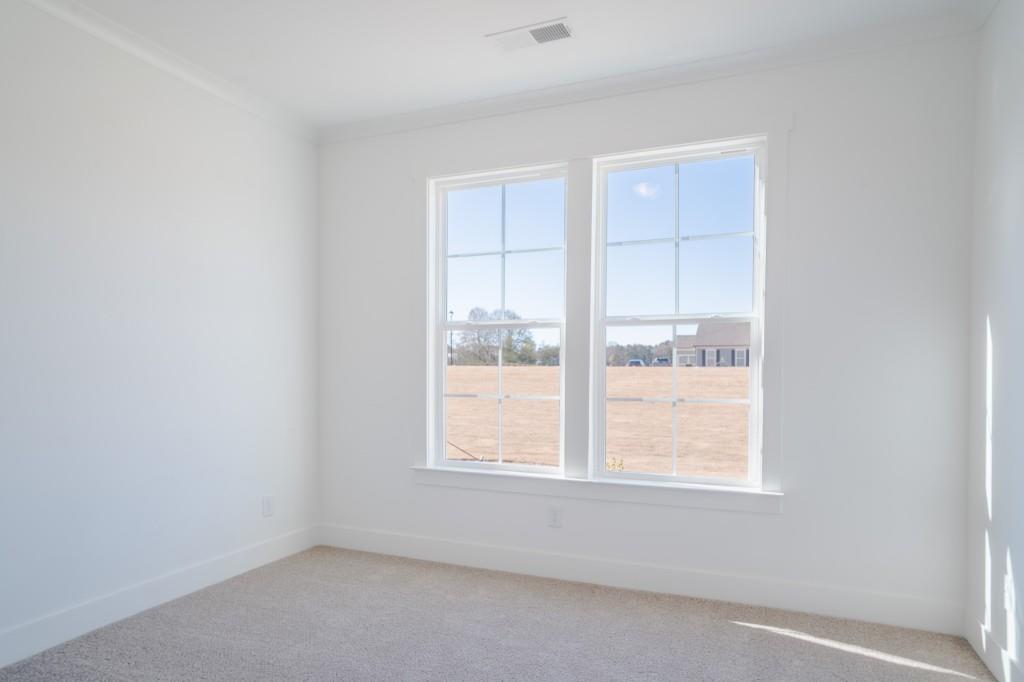 93 Tomahawk Trail Good Hope, GA 30641 - Photo 10 of 61 an empty room with a window