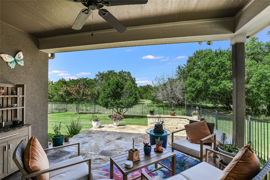 a balcony with furniture and a garden