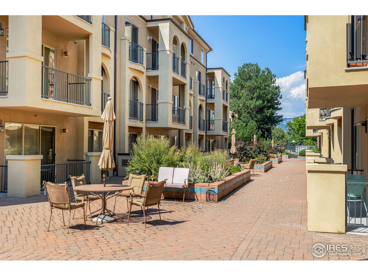 4500 Baseline Road, Unit 2107 Boulder, CO 80303 - Photo 2 of 34 a building outdoor space with patio furniture and potted plants