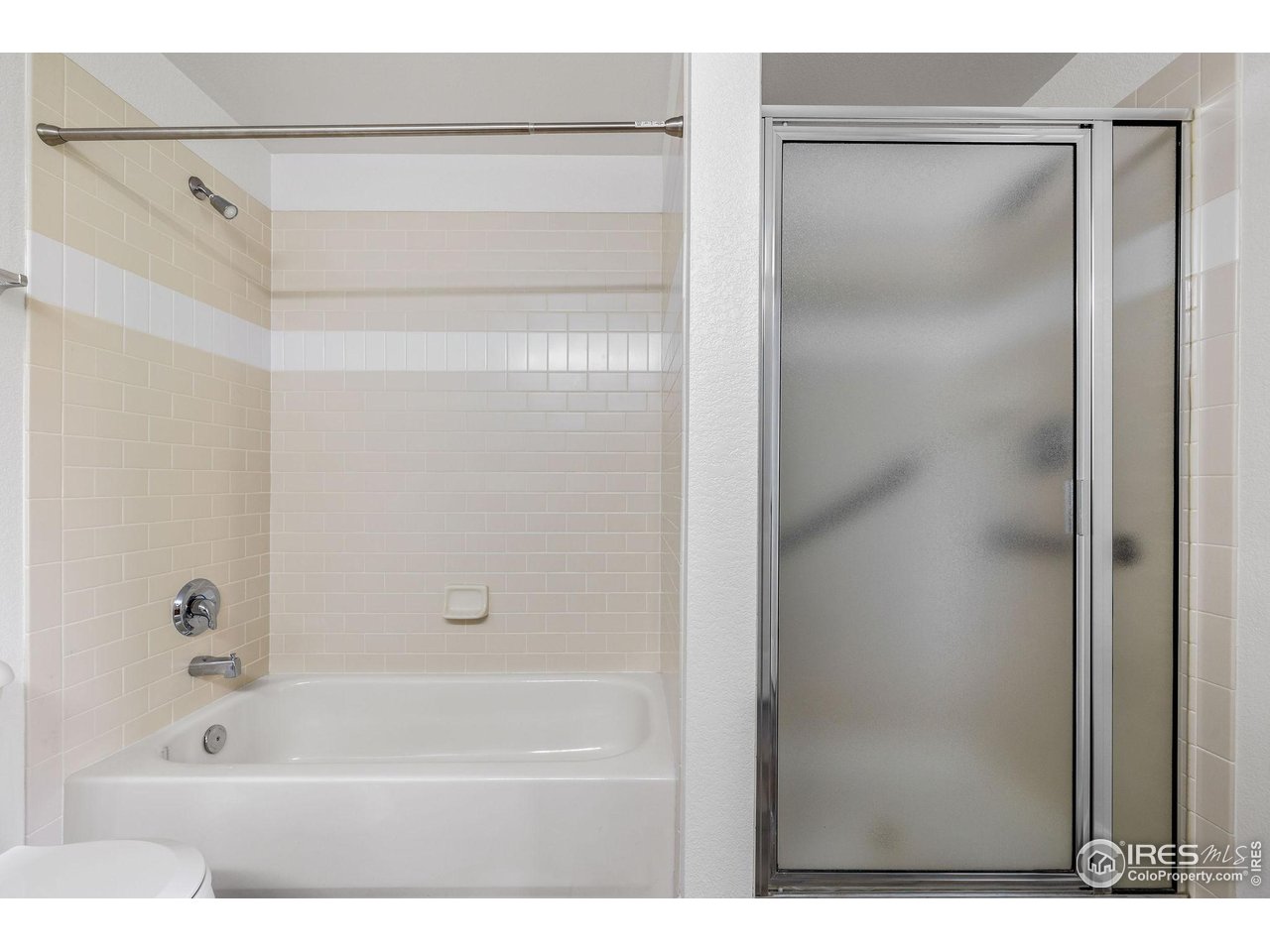 4500 Baseline Road, Unit 2107 Boulder, CO 80303 - Photo 23 of 34 a bathroom with a bathtub and a shower