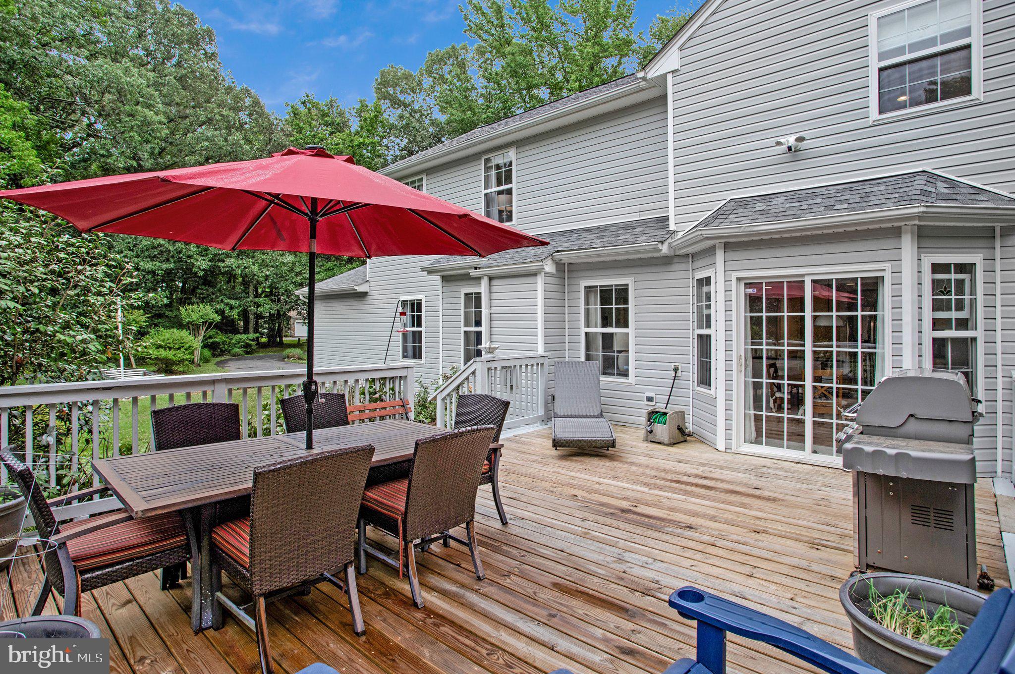 1582 Snug Harbor Road Shady Side, MD 20764 - Photo 12 of 53 Charming deck with vibrant umbrella.