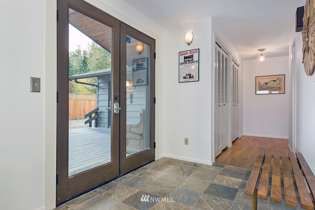 4336 Southwest Luana Beach Road Vashon, WA 98070 - Photo 12 of 40 a view of bedroom with a bed and wooden floor