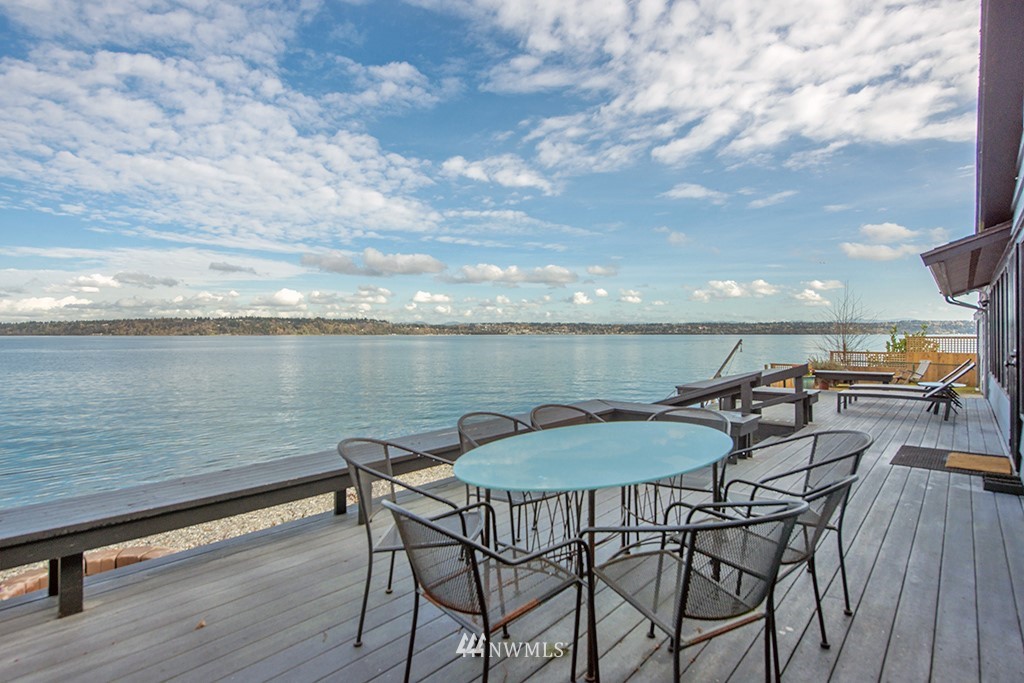 4336 Southwest Luana Beach Road Vashon, WA 98070 - Photo 28 of 40 a view of a chairs and table on wooden floor with a table and chair