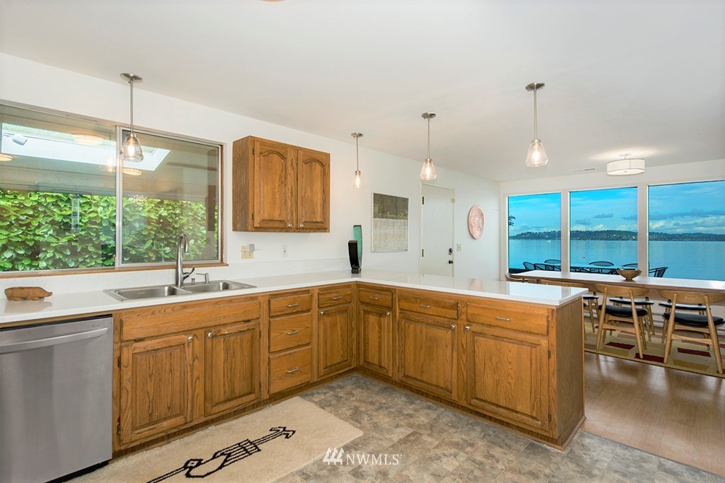 4336 Southwest Luana Beach Road Vashon, WA 98070 - Photo 9 of 40 a kitchen with a sink and cabinets