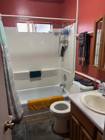 a bedroom with a bed and a table