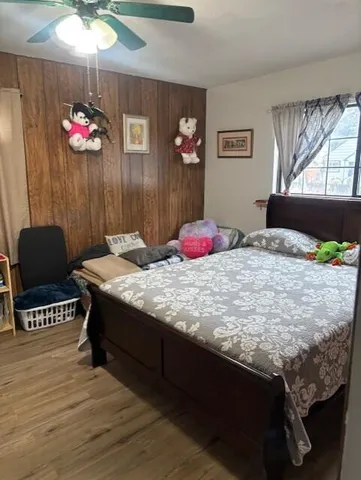 a bed room with a bed and a chandelier