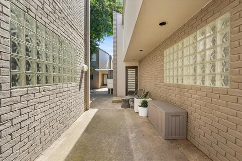 a view of a brick house with a street