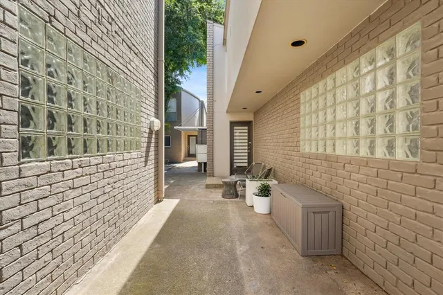 a view of a brick house with a street