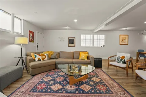 a living room with furniture and a rug