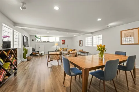 a view of a dining room with furniture and wooden floor