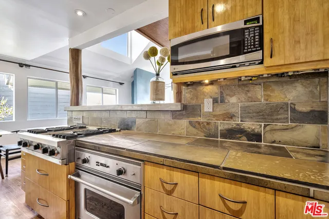 a living room with fireplace furniture and a flat screen tv