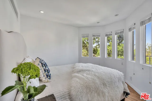 a bathroom with a shower a toilet and sink