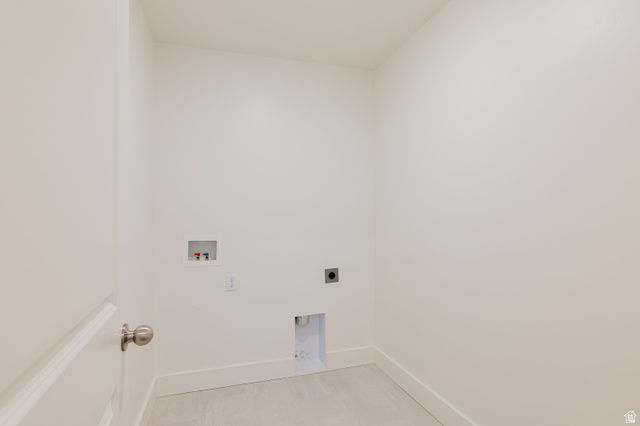433 North 600 West Smithfield, UT 84335 - Photo 22 of 40 Dedicated laundry area featuring a white door with a brushed nickel knob, white baseboards, and light-toned tile flooring