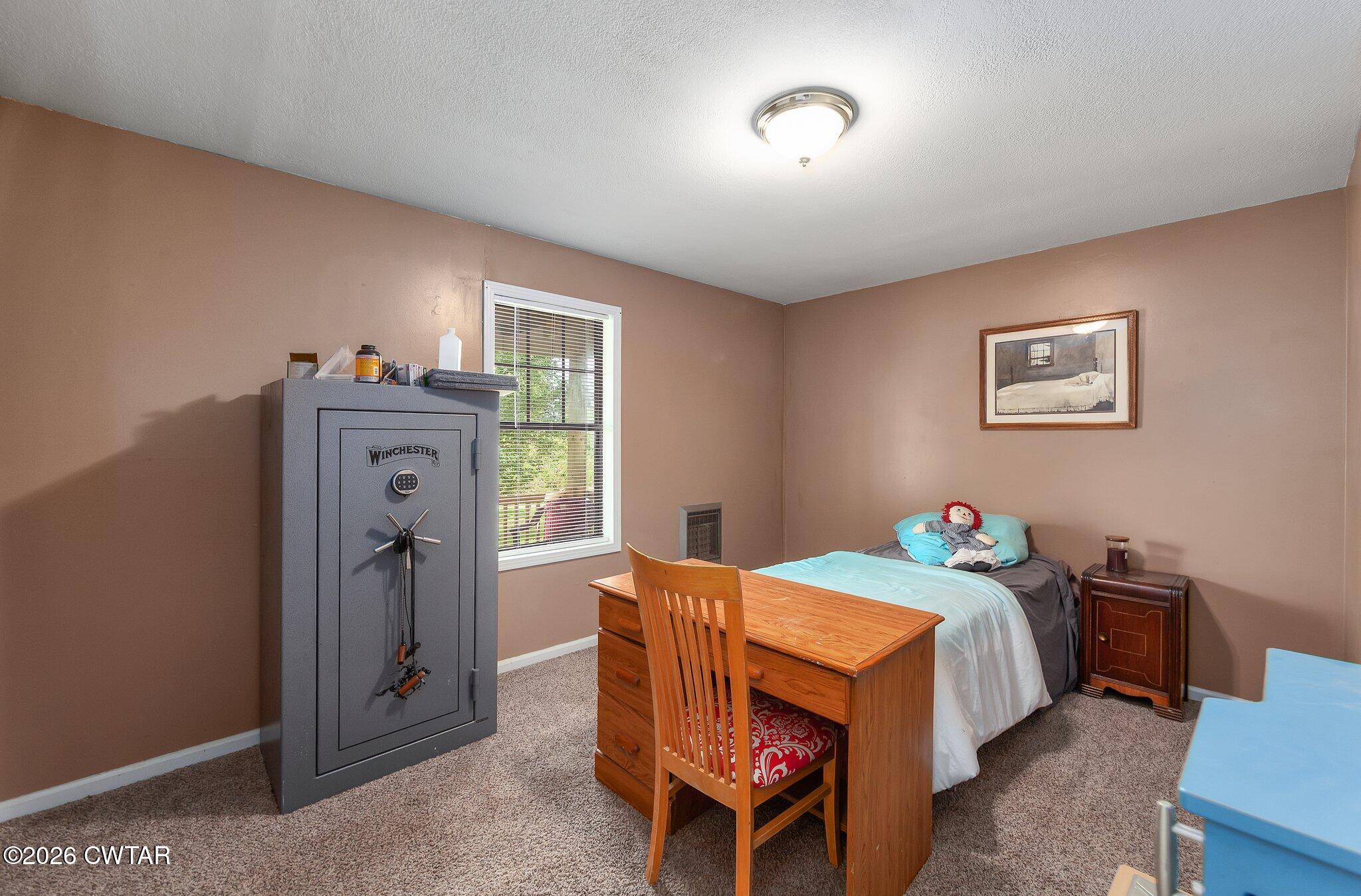 101 Wilde Road Pinson, TN 38366 - Photo 11 of 16 a bed room with a bed and a window