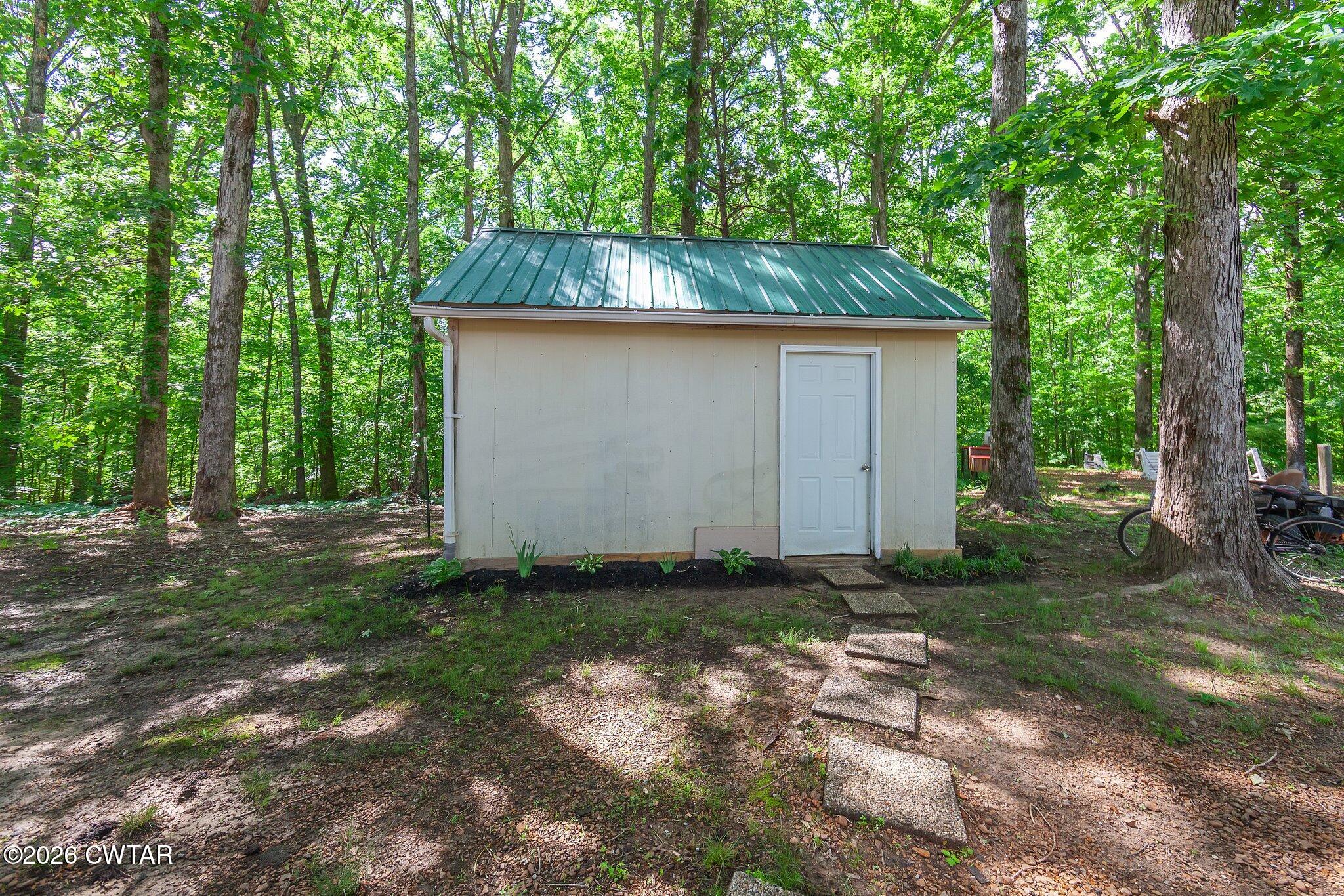 101 Wilde Road Pinson, TN 38366 - Photo 15 of 16 a backyard of a house with lots of green space