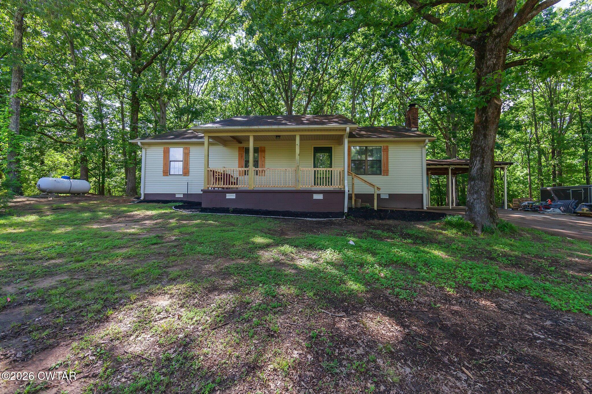 101 Wilde Road Pinson, TN 38366 - Photo 16 of 16 a front view of a house with garden